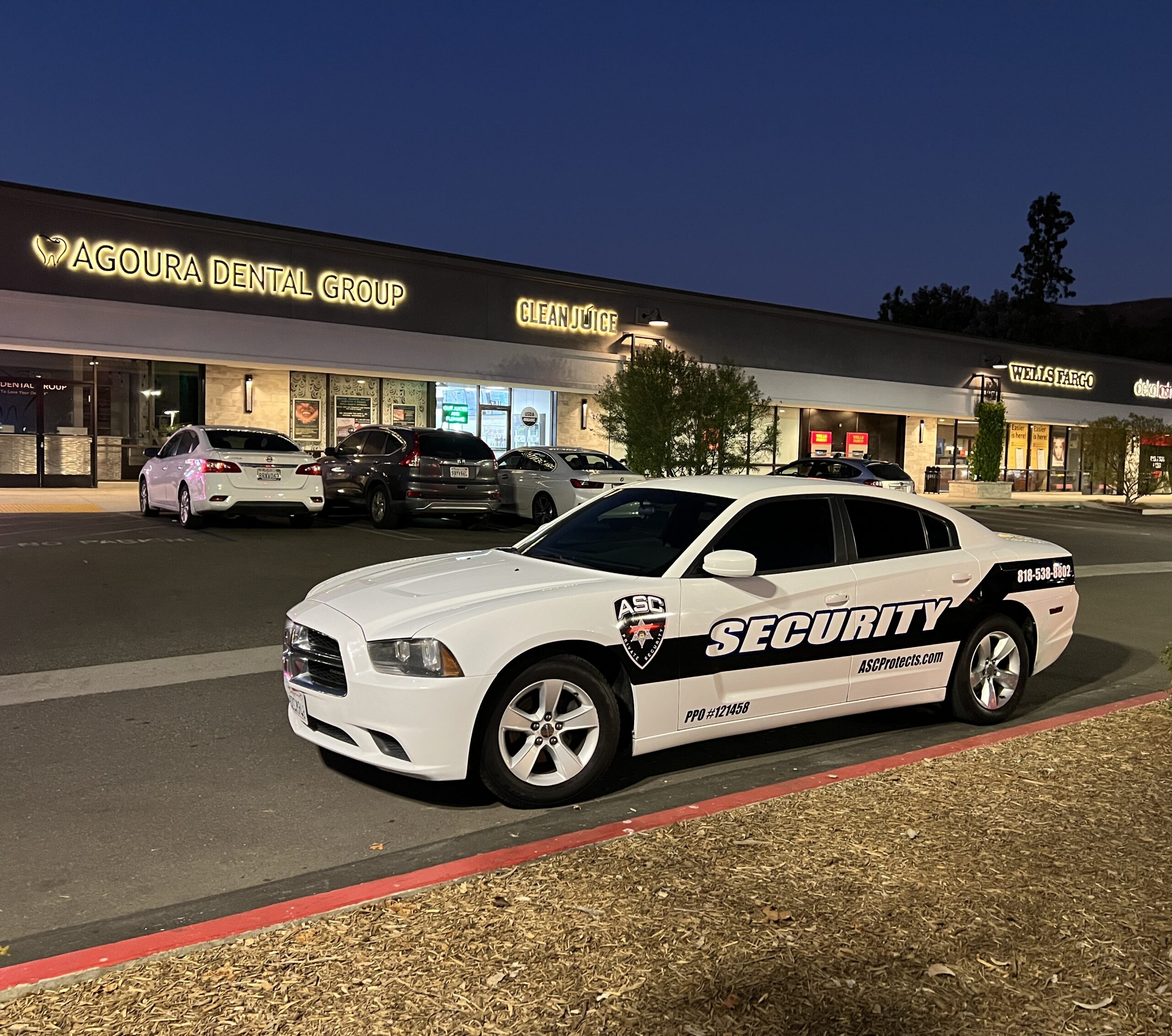 ASC Private Security's mobile patrol car in front of Agoura Dental Group